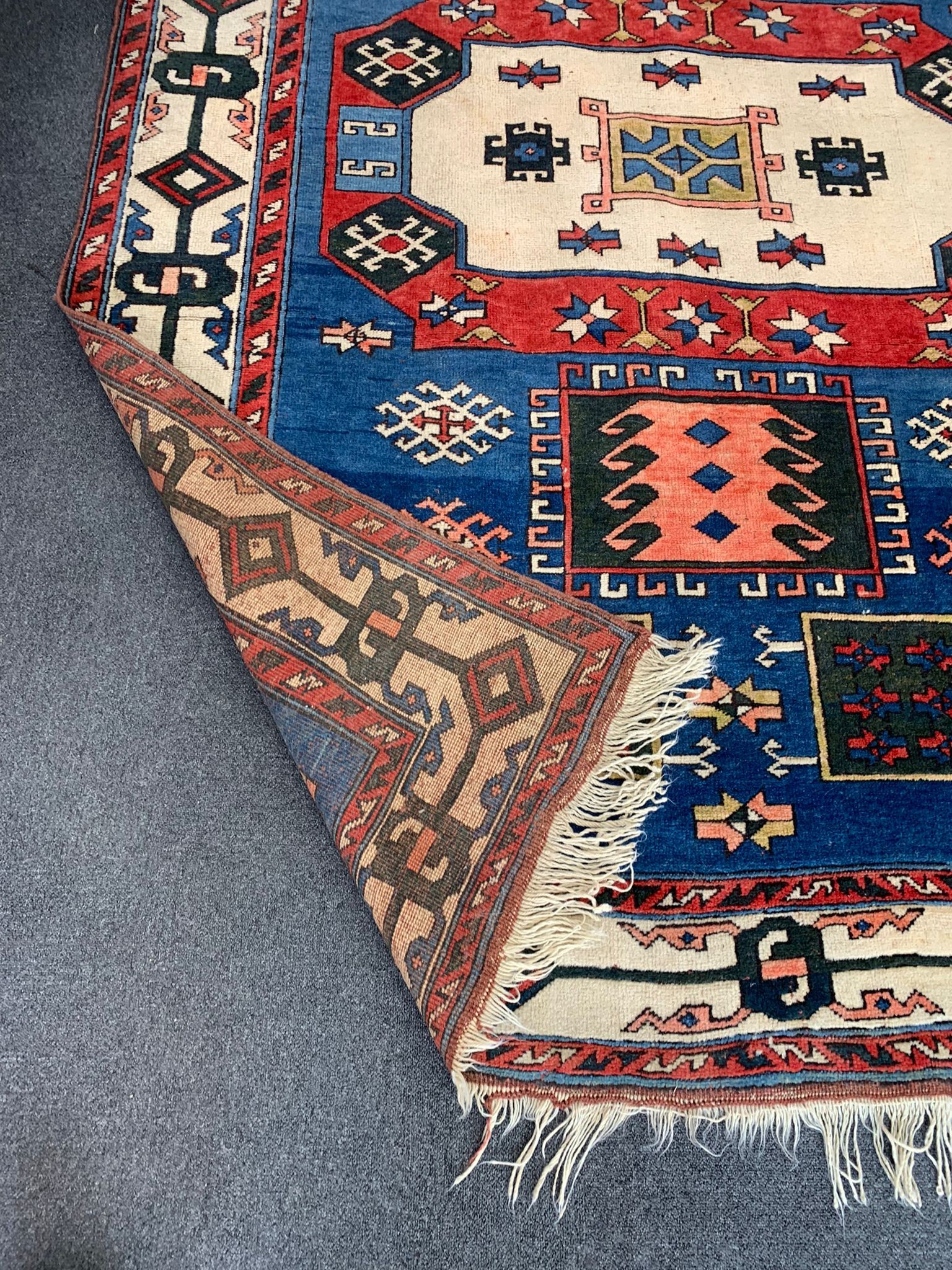 A Caucasian style blue ground carpet, 250 x 180cm